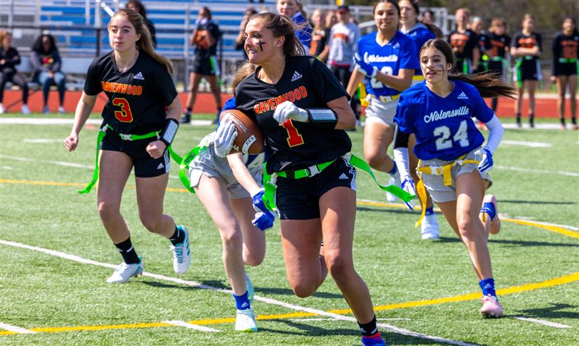 Girls play flag football